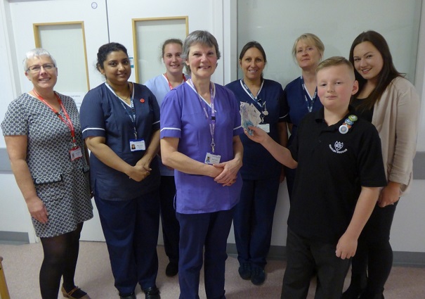 Joshua Reed with his mother and staff from SCBU