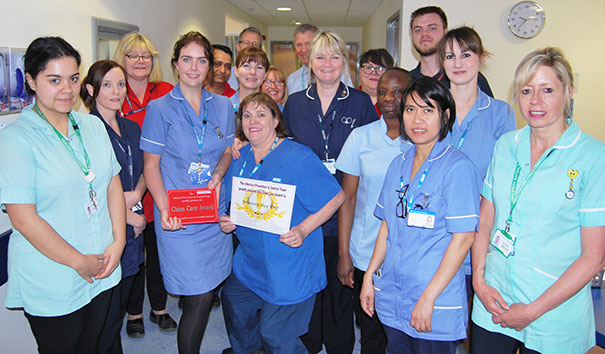 Pevensey Day Unit presented with their award by Chief Executive, Dr Adrian Bull