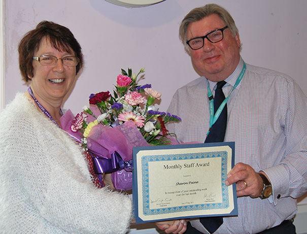 Sharon Paine being presented with her award by Chairman, David Clayton-Smith