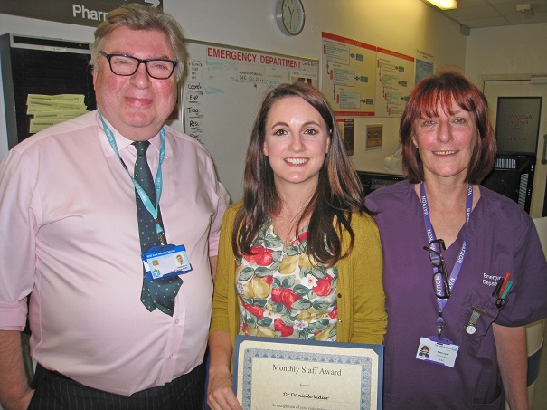 Dr Vidler receives her award from Chairman David Clayton-Smith and Matron Eileen Carter.