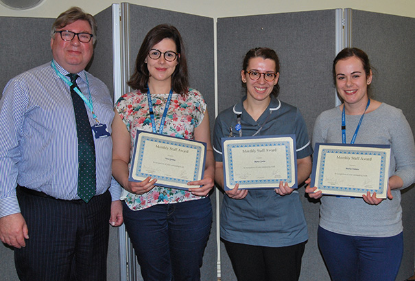 Trust Chairman David Clayton-Smith presents the award to Staff Nurses Vera Quintes, Marta Cunha and Marisa Ferreira