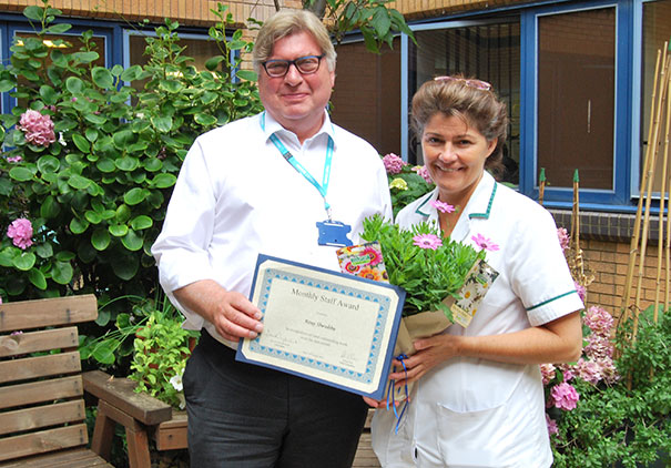 Rosy Shrubbs presented with her award by Chairman David Clayton-Smith