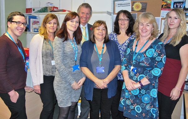 Chief Executive Adrian Bull with the team at Eastbourne DGH