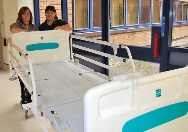 Jane Anscombe and Martinha Kirk from the Trust’s Electronics and Medical Engineering Department delivering one of the beds