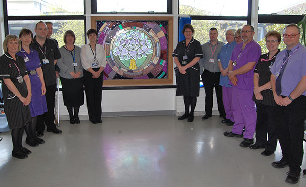 Staff at the unveiling of the new window