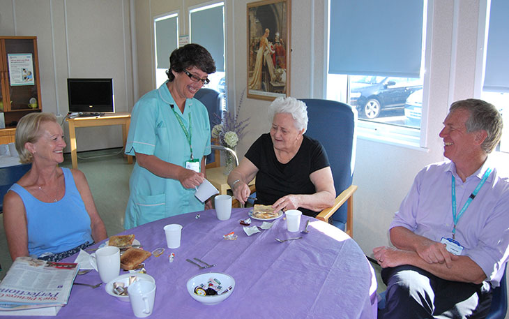 Dr Adrian Bull, Chief Executive talks to patients having breakfast in the discharge lounge