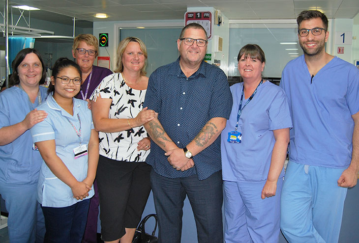 Phil Wilkinson his wife Michelle and some of the Critical Care team