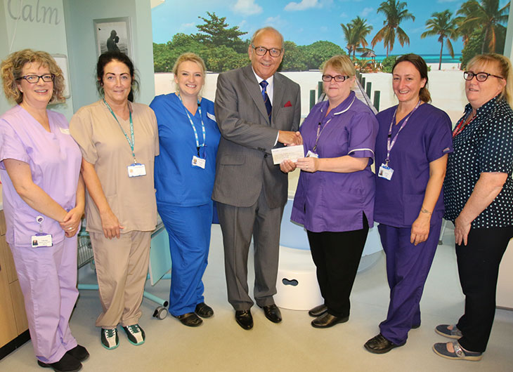 Colin Dann, Trustee of the Sussex Masonic Charities (middle) with Matron Kirsty Milward and team 