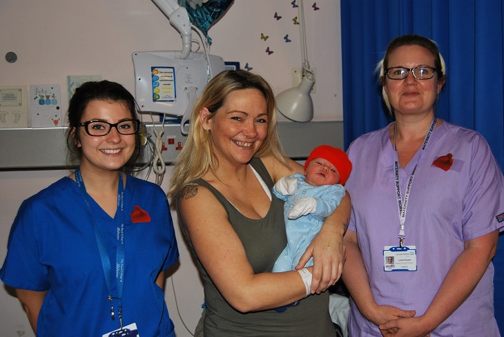 Mother Natalie with baby Roco and Frank Shaw Ward members