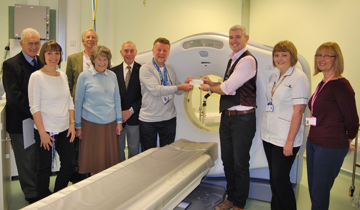 Harry Walmsley Chairman Friends of Eastbourne Hospital presents cheque to Dr Neil Barlow Consultant Radiologist 