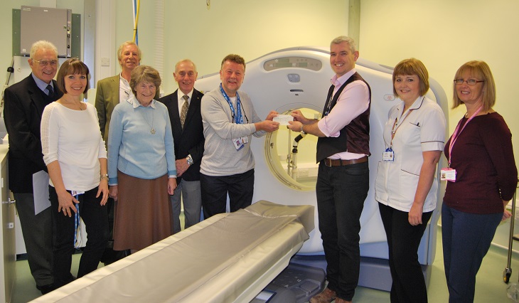 Harry Walmsley Chairman Friends of Eastbourne Hospital presents cheque to Dr Neil Barlow Consultant Radiologist