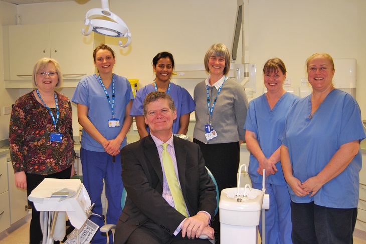 Stephen Lloyd with Leona Toner Head of Community Dental Services and team at the Ian Gow Medical Centre.