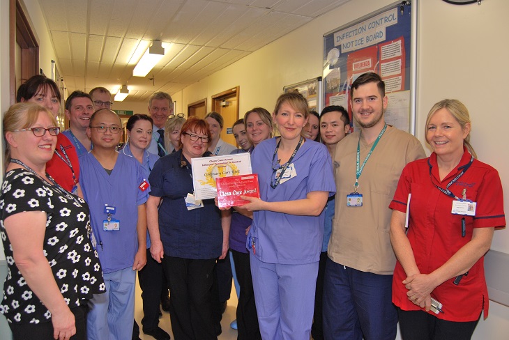 Coronary Care Unit team receive their award from Dr Adrian Bull, Chief Executive