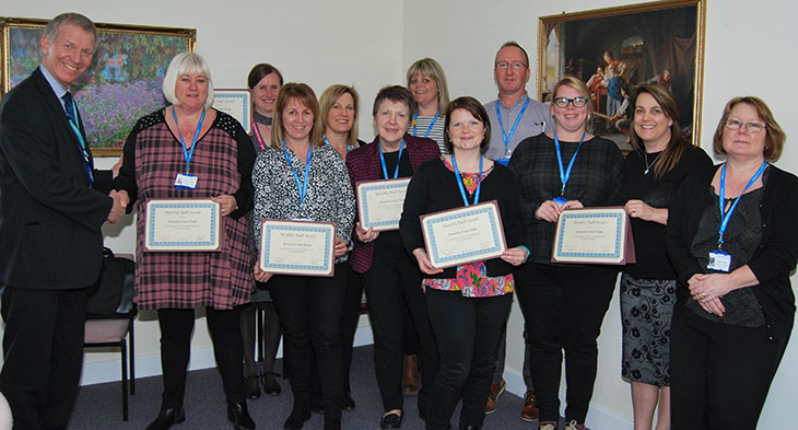 Chief Executive, Dr Adrian Bull presenting the Proactive care team with their award