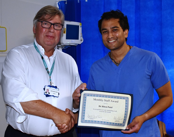 Dr Hiten Patel being presented with his award by Chairman David Clayton-Smith