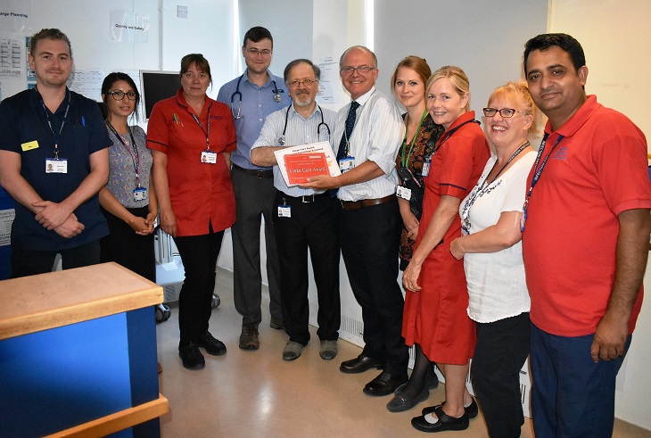 Seaford 3 at Eastbourne DGH receives the Clean Care Award from Dr David Walker 