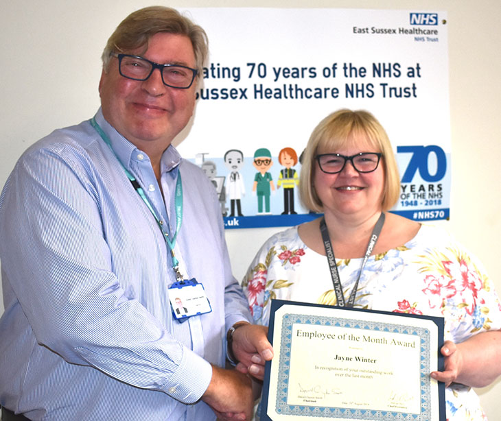 Nursing Team Leader, Jayne Winter, receiving her award from Trust Chairman, David Clayton-Smith