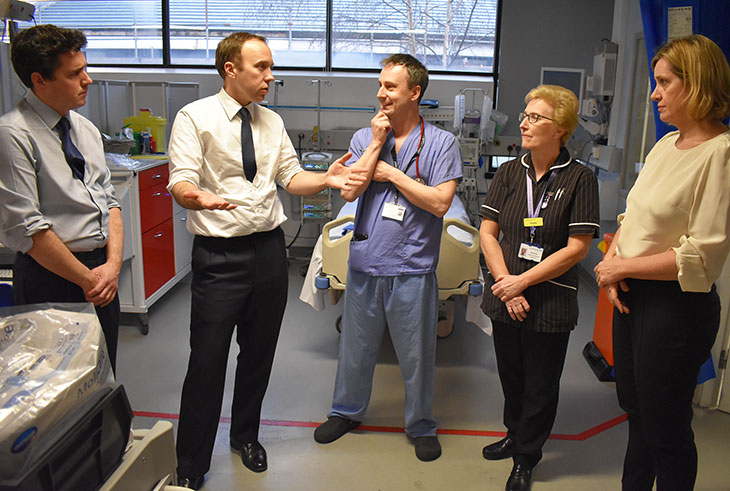 Secretary of State for Health and Social Care, Matt Hancock with Huw Merriman MP for Bexhill and Battle (Left) and Rt Hon Amber Rudd, Secretary of State for Work and Pensions (right) speaking with Chris Scanlan, Consultant Anaesthetist and Pauline Simes, Critical Care Lead Nurse