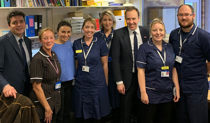 Secretary of State for Health and Social Care, Matt Hancock with Huw Merriman MP for Bexhill and Battle (Left) speaking with the Hastings and Rother Frailty Team based in the Irvine Unit at Bexhill Hospital