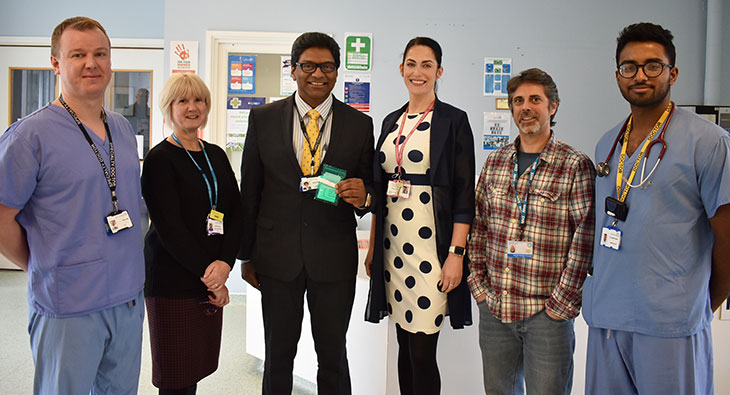 Some of the Colorectal team with Mr Raj Harshen, Consultant General and Colorectal Surgery holding the new Faecal Immunochemical Test kit
