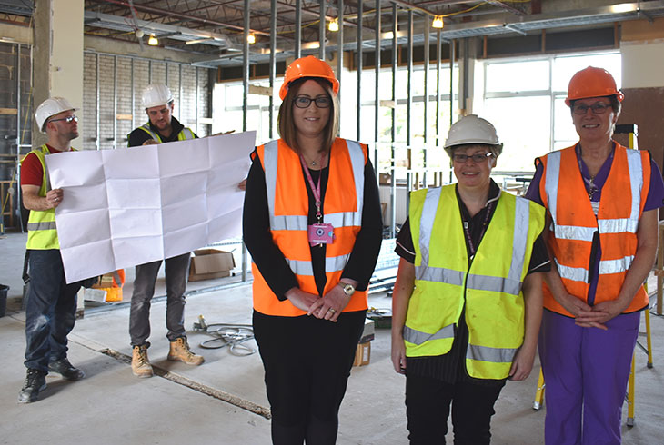 Some of the Urology team inspect the start of building work