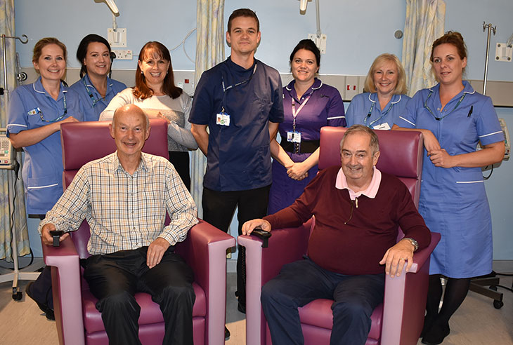 Bill Hamilton Chairman of The Friends of Conquest Hospital (siting right) with Tom Banner, Infusion Unit Charge Nurse (back and centre) with McCartney Infusion Unit staff