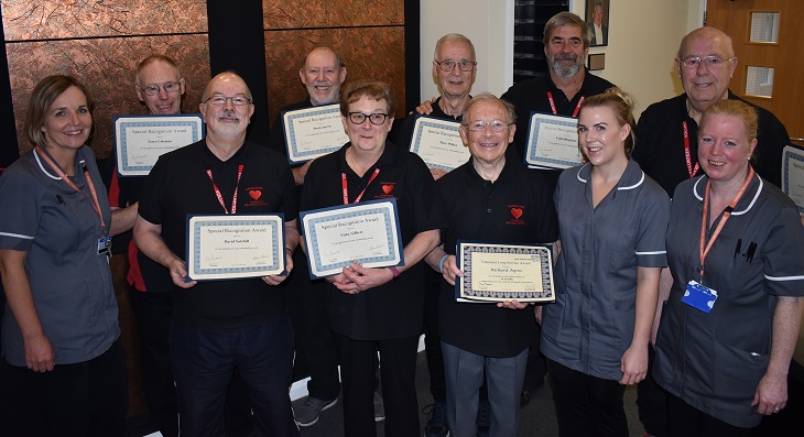 Cardiac rehabilitation volunteers with their certificates and the cardiac rehabilitation team