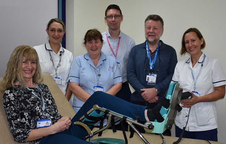 Harry Walmsley, Chairman of the Friends of Eastbourne Hospital with physiotherapy team