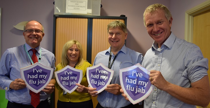 Medical Director Dr David Walker, Head of Infection Prevention and Control Lisa Redmond, Respiratory Consultant Dr James Wilkinson and Chief Executive Dr Adrian Bull show their support for having a flu jab