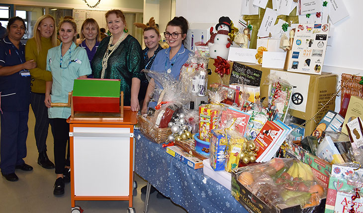 Gardner Ward staff with author Kate O'Hearn who drew the raffle