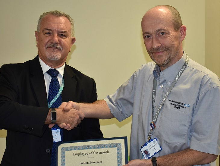 Sim Beaumont Electronics and Medical Engineering Manager receives award from Trust Chairman Steve Phoenix