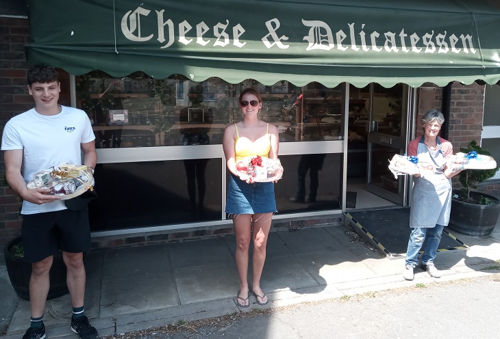 Ross Chambers and Anya White, two new young volunteers, and Julie Harris who runs the delicatessen in Bexhill, who put together 21 hampers for volunteers.