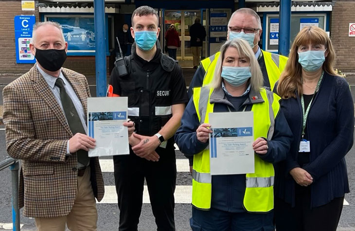 Sussex Police Designing Out Crime Officer Phil Edwards presenting  the award to Liz Nicholas Parking Supervisor and Pauline Blythin, Security Supervisor. 