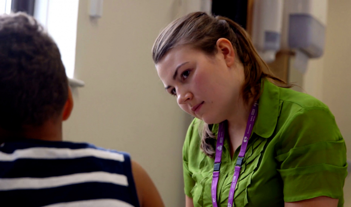 Speech and language therapist with patient
