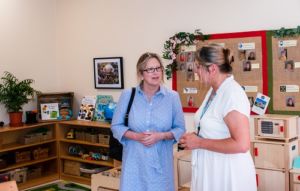 Sally-Ann Hart MP, Jacquie Fuller Staff Engagement Wellbeing Manager, talk inside First Steps Nursery at Conquest Hospital