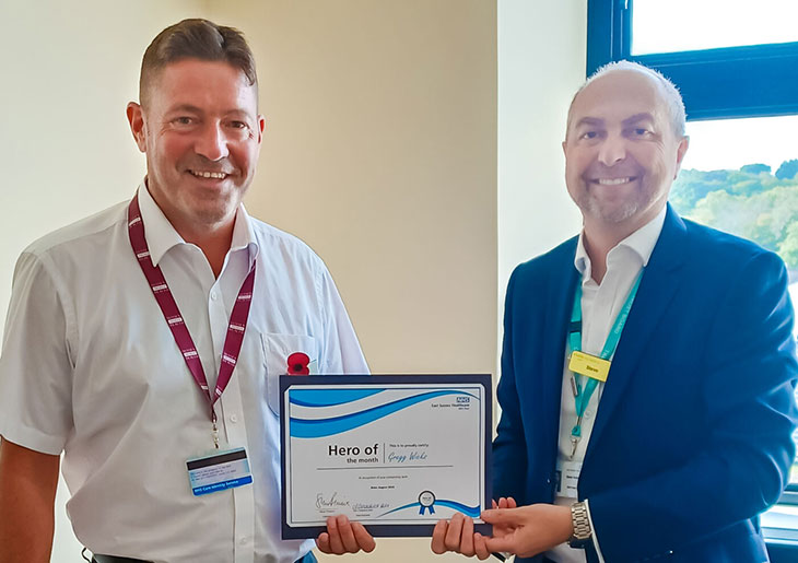 Gregg Wicks being presented with his certificate by Steve Aumayer, Deputy Chief Executive and Chief People Officer