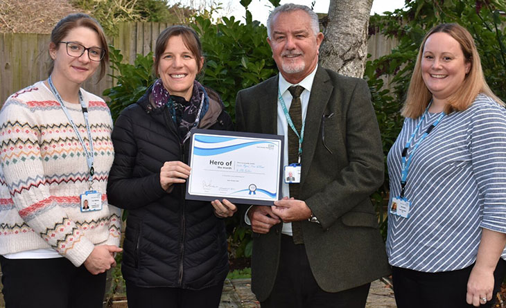 Louise Myeni, Fran Williams and Ella Butler, our physio and occupational therapy development team, who won our Hero of the Month award being presented with their award by Chair, Steve Phoenix