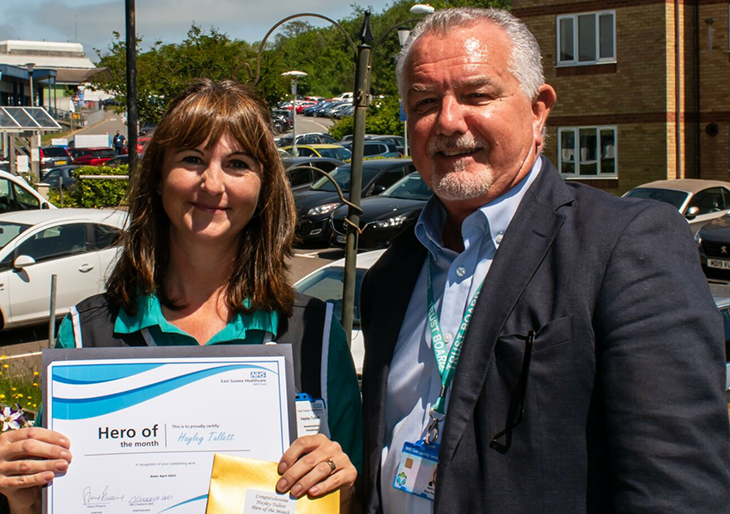 Hayley Tullett, a Housekeeper in the residences at Conquest Hospital with Steve Phoenix, Chair