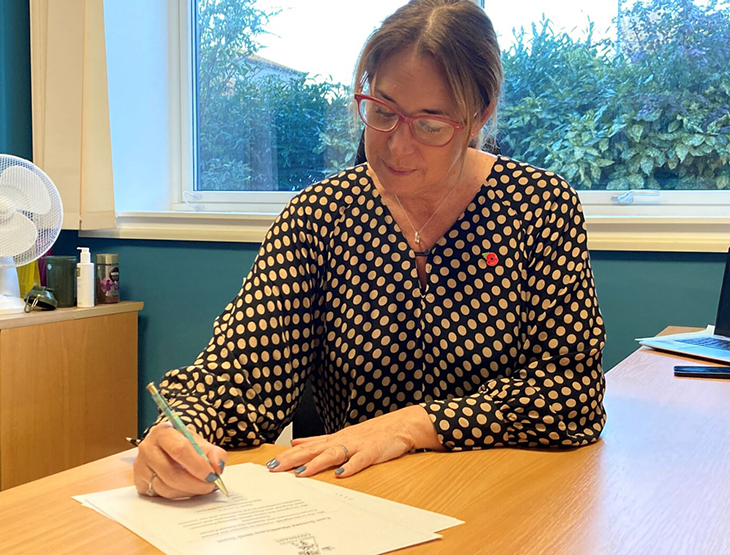 Joe Chadwick-Bell, Chief Executive signs the Armed Forces Covenant