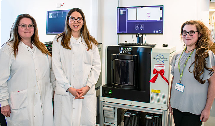 Members of the Pathology team with one of the new scanners