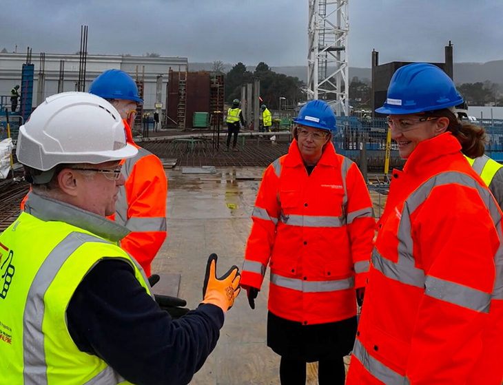 People being shown around the site of the new unit