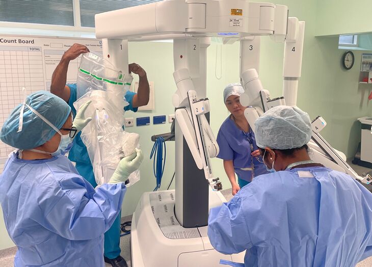 The surgical team preparing the da Vinci XI robotic-assisted surgical system