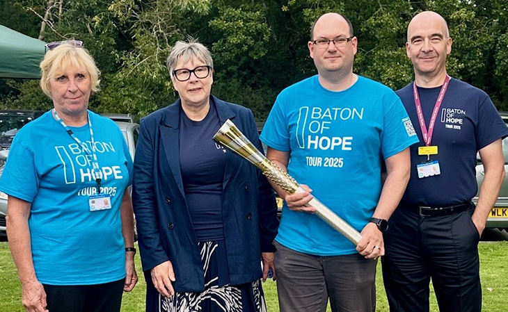 Baton bearers Mark Fincher and Gillian Grattan, with Jenny Darwood and Paul Smith