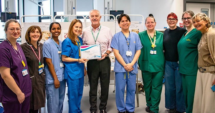 Critical care team being presented with their award by Chairman Steve Phoenix