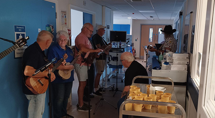 Ukulele band playing in a ward at Eastbourne DGH